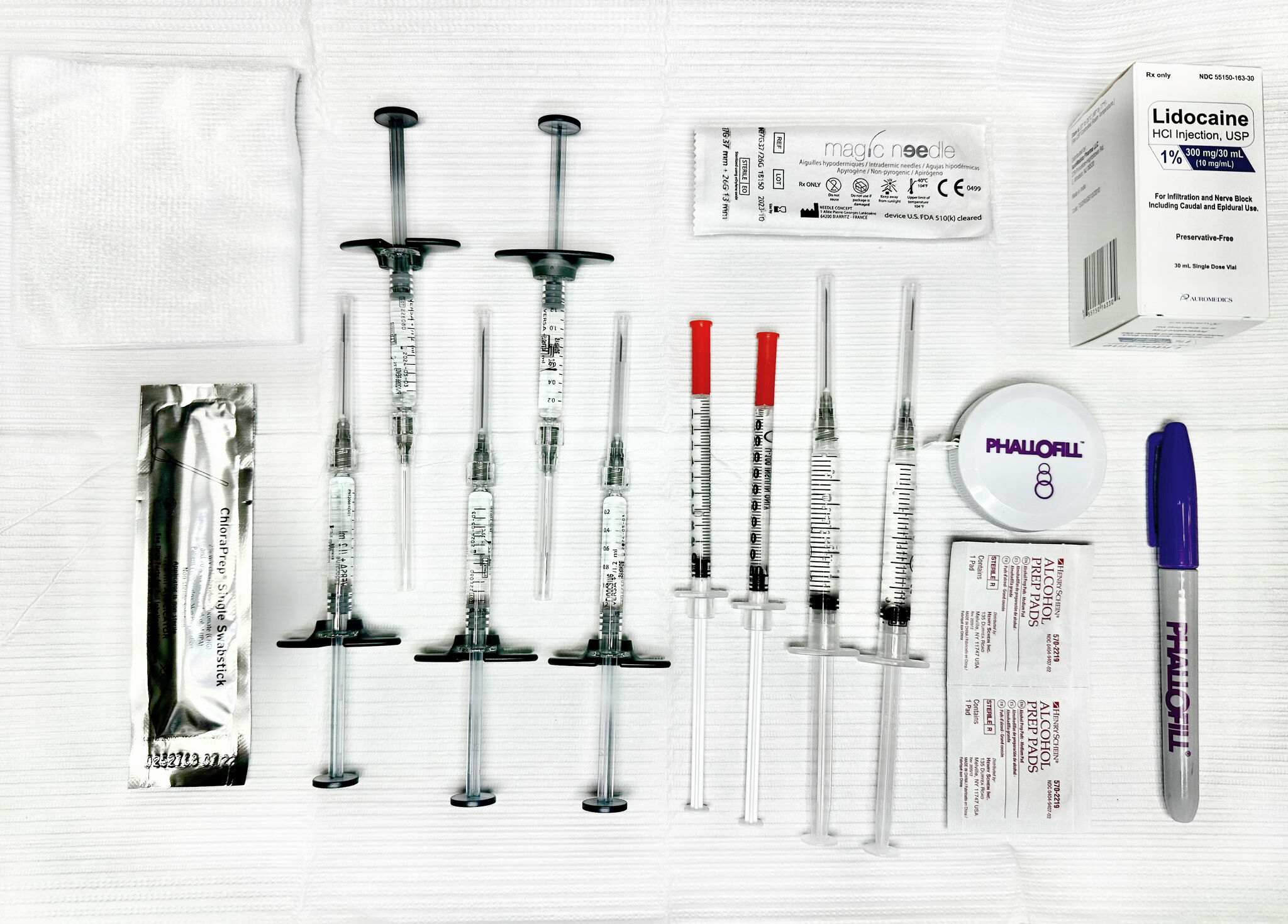 Phallofill filler injection kit laid out on a sterile field